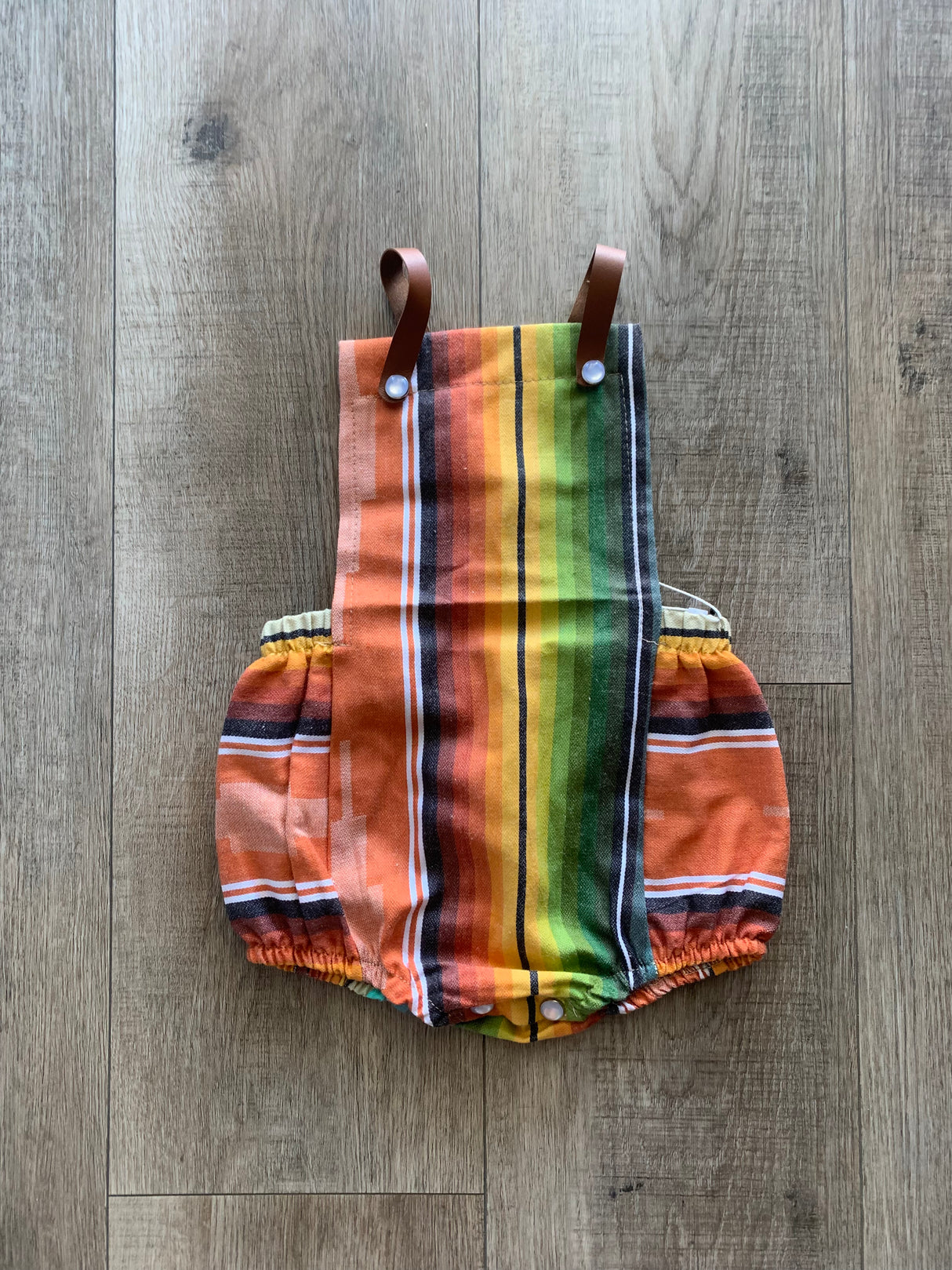 Rust Serape Leather Strap Onesie